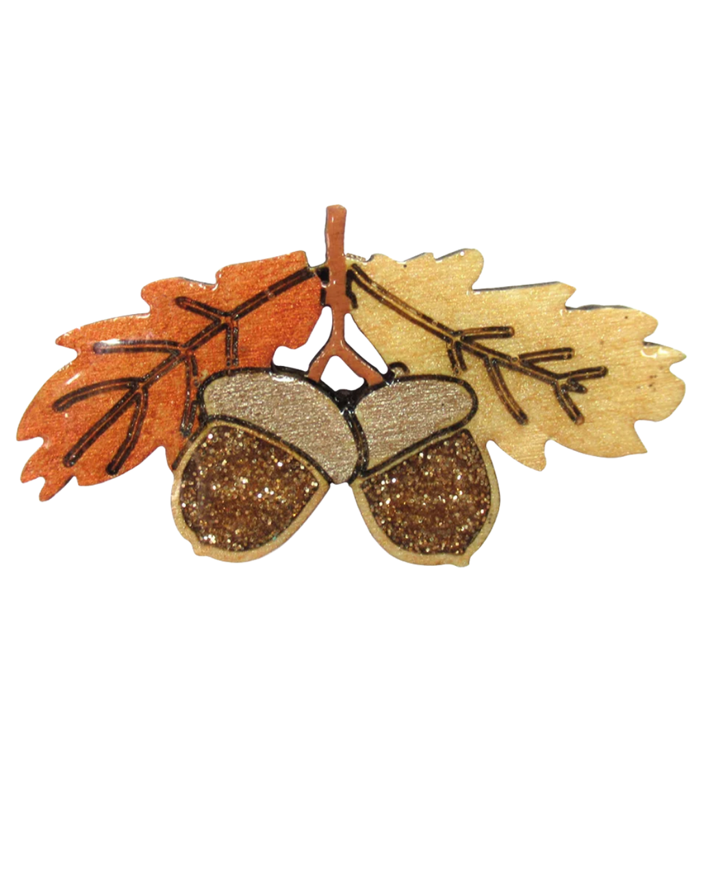 Acorn and autumn leaf embellishment featuring two glittery brown acorns with beige caps, set against orange and beige leaves on a brown stem, isolated on a white background.