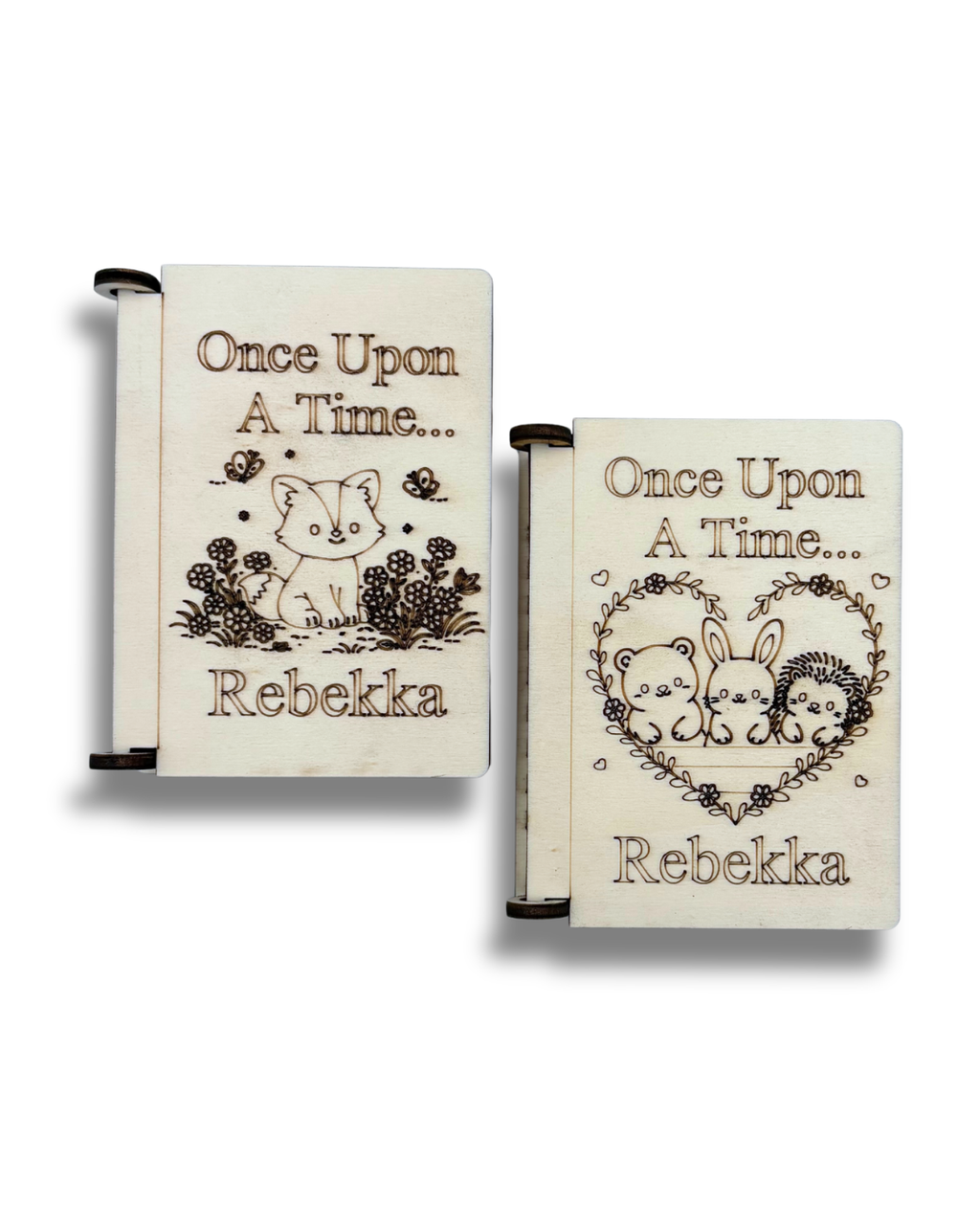 Two personalized wooden keepsake boxes featuring laser-engraved designs of a fox, a bear, a rabbit, and a hedgehog in a heart with the text 'Once Upon A Time.